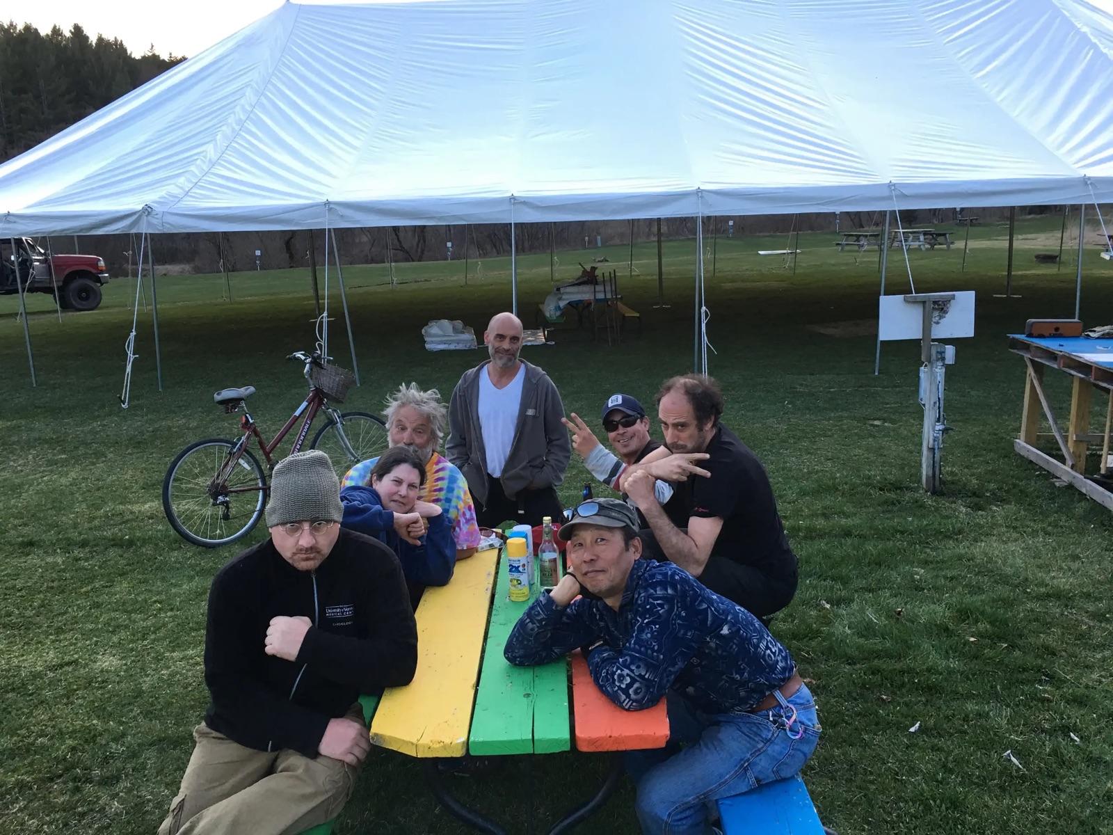 Campers gathered under the event tent on the lawn
