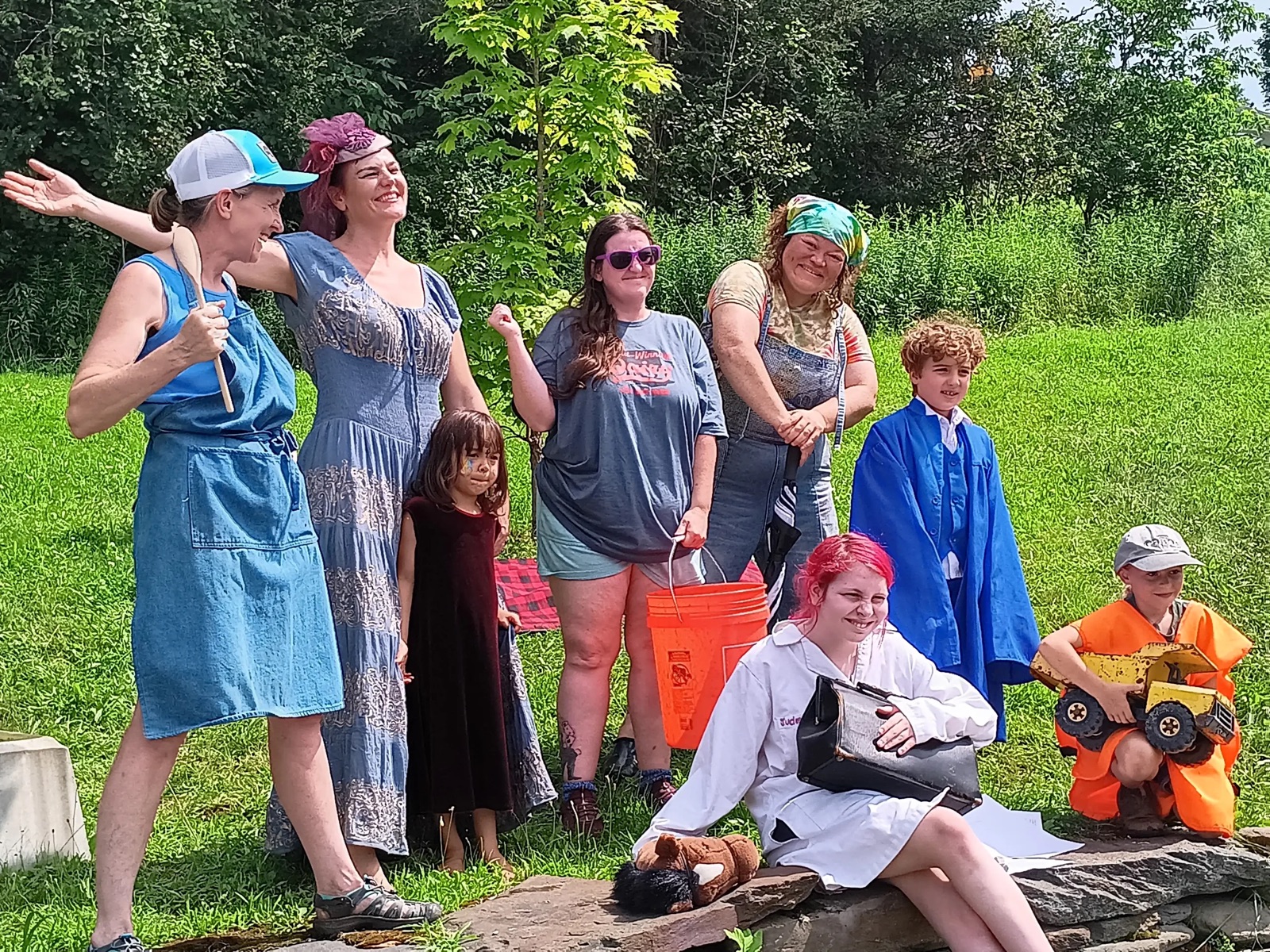 A group of campers posing together in the sun